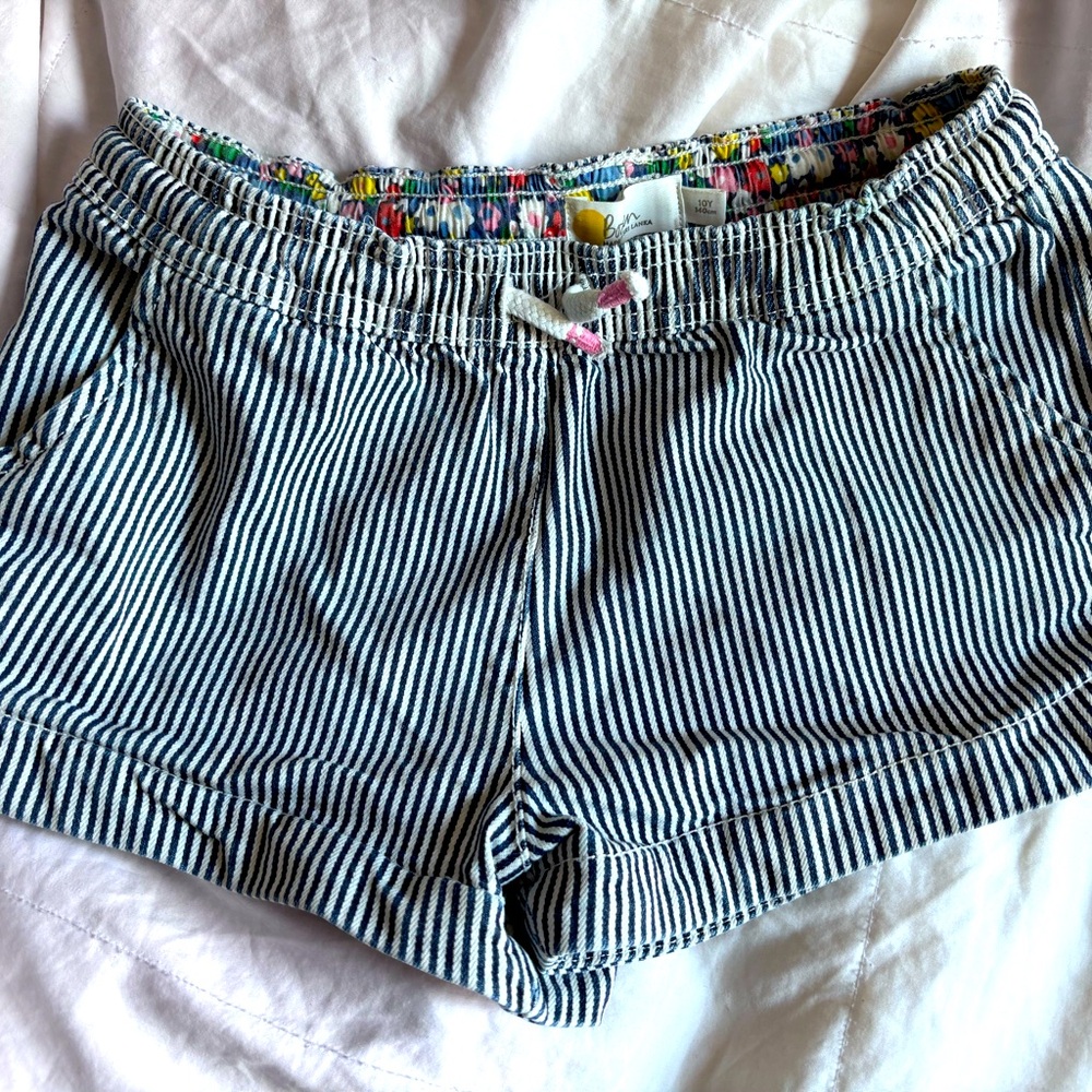 Girls Mini Boden Jean shorts size 10. Blue /white stripes.  Heart back pockets
